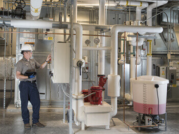 Female technician providing maintenance services at a client facility